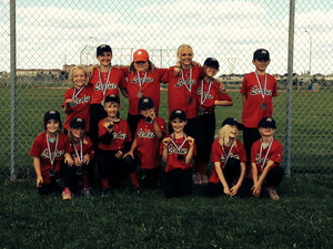 A Leduc Minor Softball team photo shows the happiness that belonging to a team can give a child