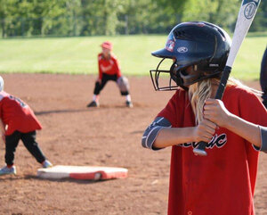 A youthful batter eyes the next pitch during fun times with Leduc Minor Softball